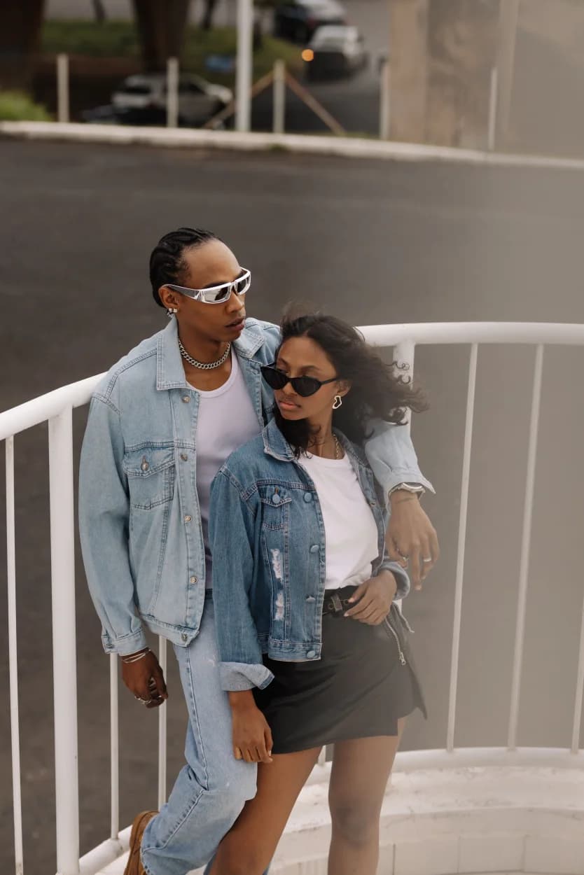 Two friends wearing layered city outfits