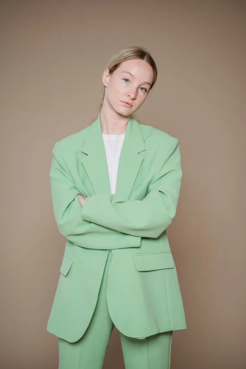 Person wearing a pale green blazer